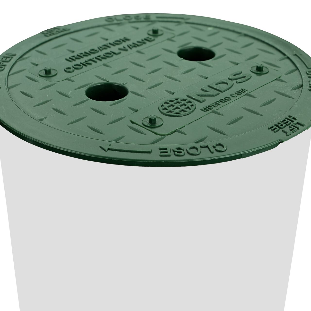 Closeup view of the 6 in. Standard Series Valve Box with the Irrigation Control Valve Cover installed with a 6 in. drainage fitting coupler (NDS 6P05) and SDR-35 sewer and drain pipe (NDS 2107BC)