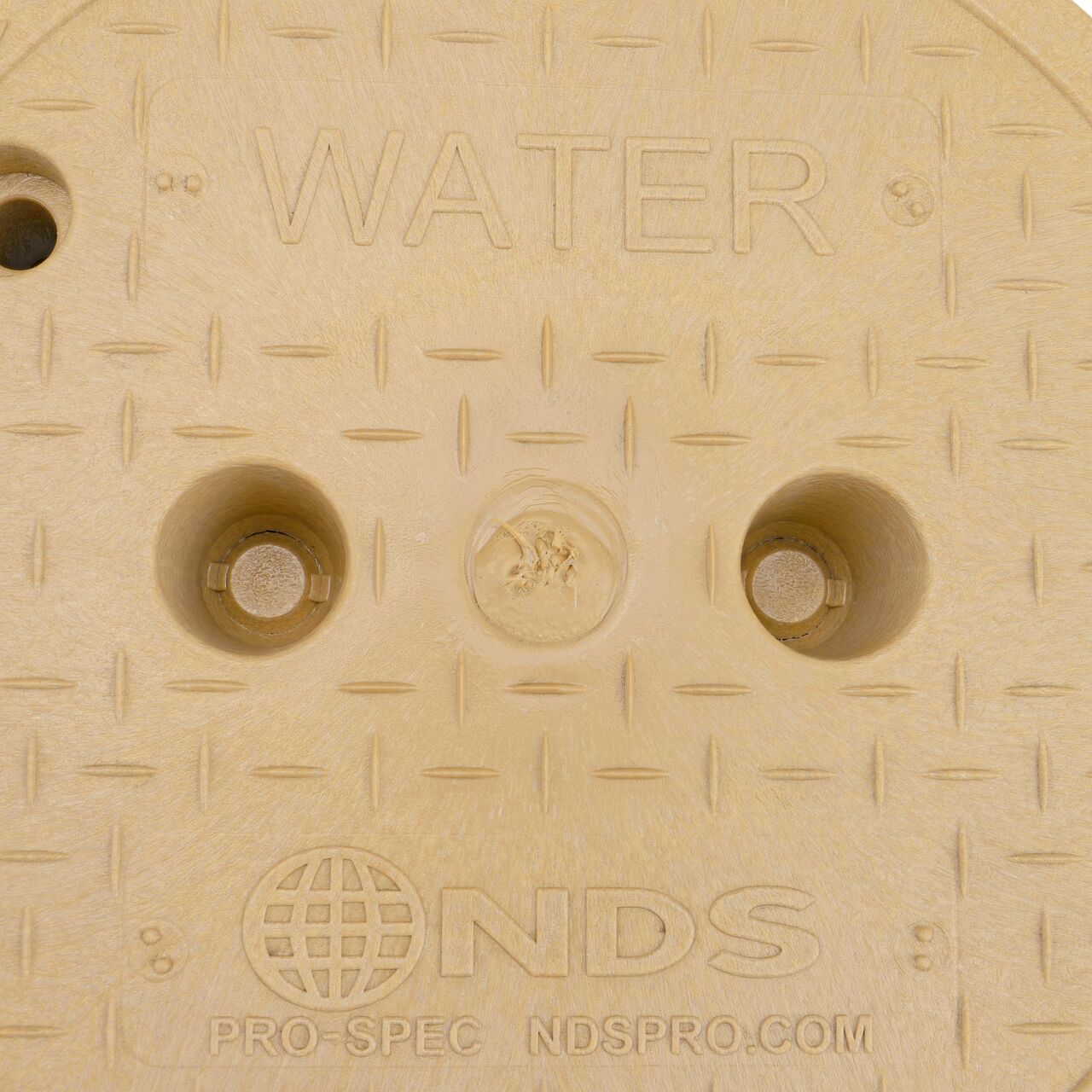 Closeup view of the Water markings on the Sand Water cover for the NDS 10 in. Round Pro-Spec® Series Valve Box (NDS 312BCBWSAND)