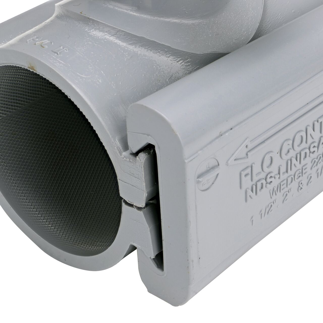 Closeup view of the wedge securely in the closed position on the 2 in. NDS Flo-Tap™ Rigid PVC saddle with 3/4 in. socket or 1 in. spigot (NDS 3120)