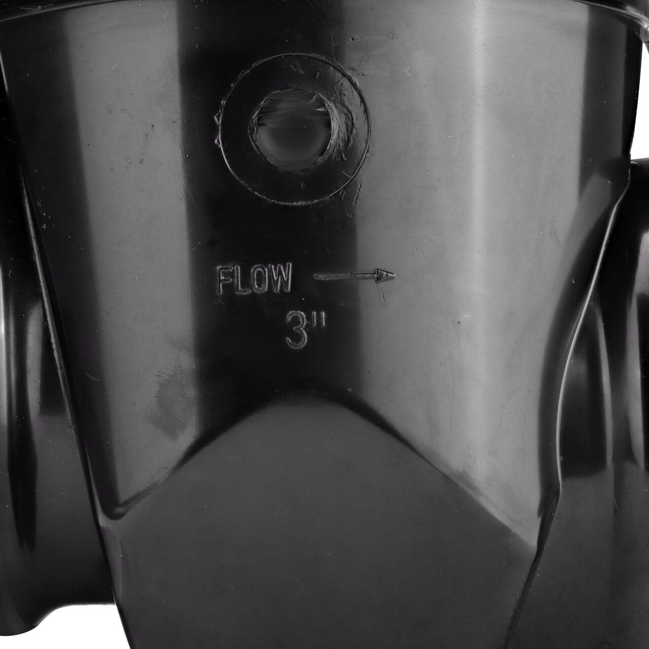 Closeup of the outside part of the NDS 3 in. Backwater Valve with stamped arrow showing the direction in which the water will flow (NDS 375)