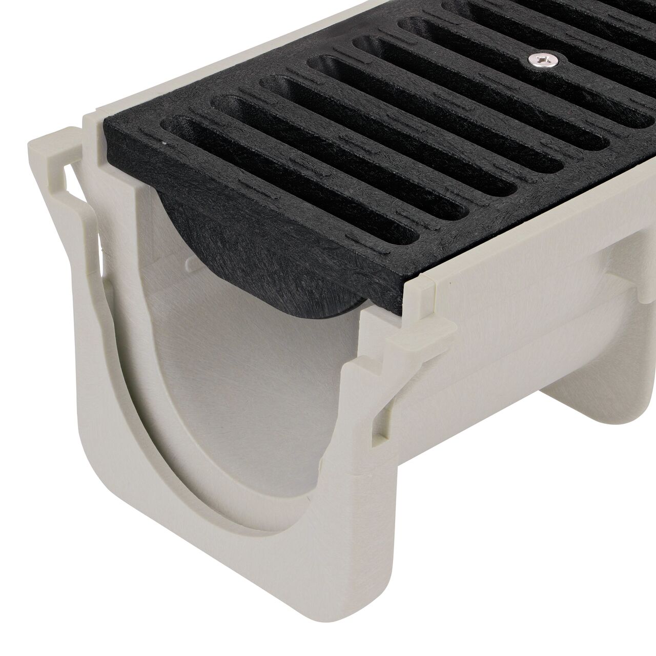 Closeup View of the sand plastic Dura Slope™ Channel Drain Grate (NDS 664) installed on the Dura Slope Channel Drain (NDS DS-091)