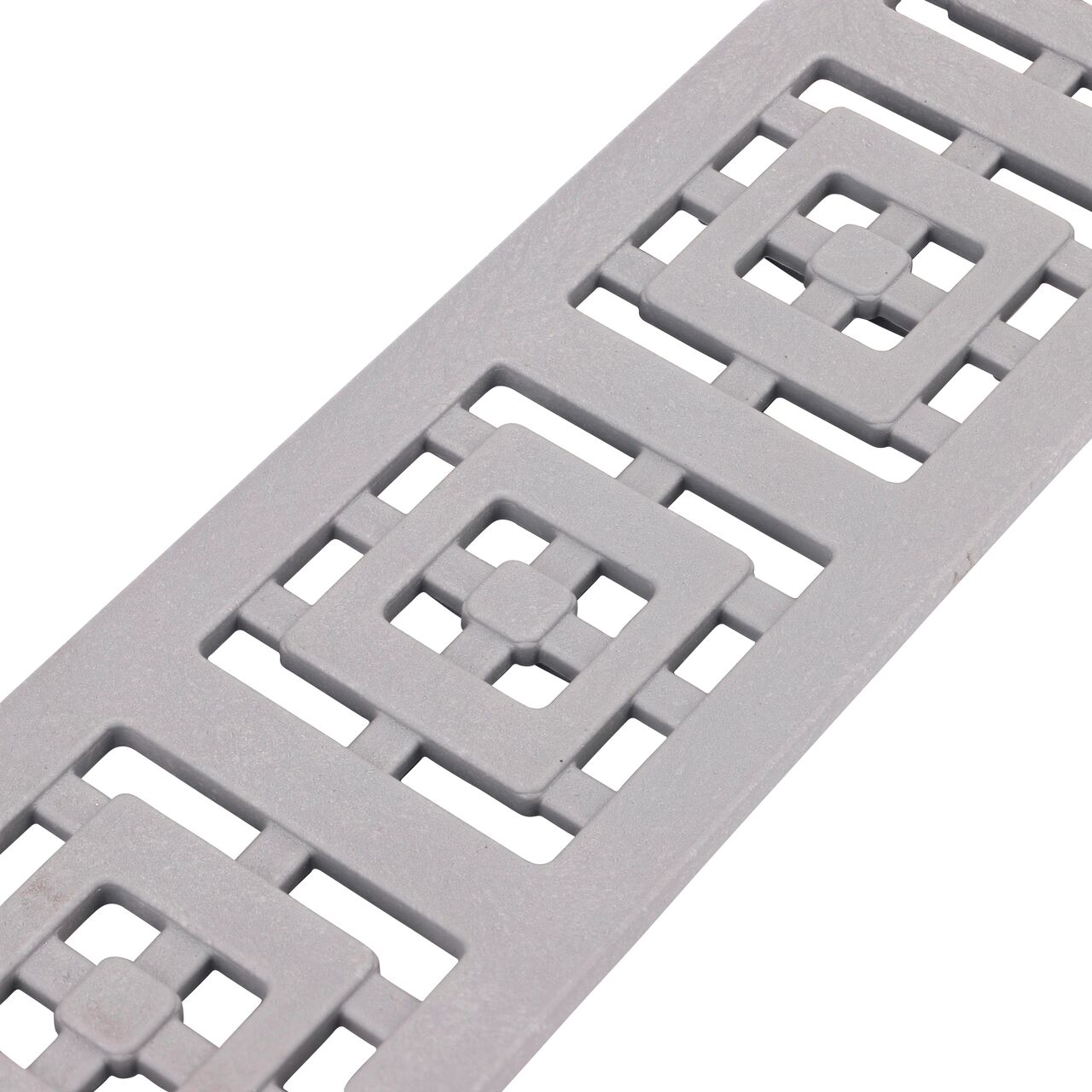 Angled closeup view of the Slim Channel™ Gray Decorative Square Design Drain Grate (NDS 9253)