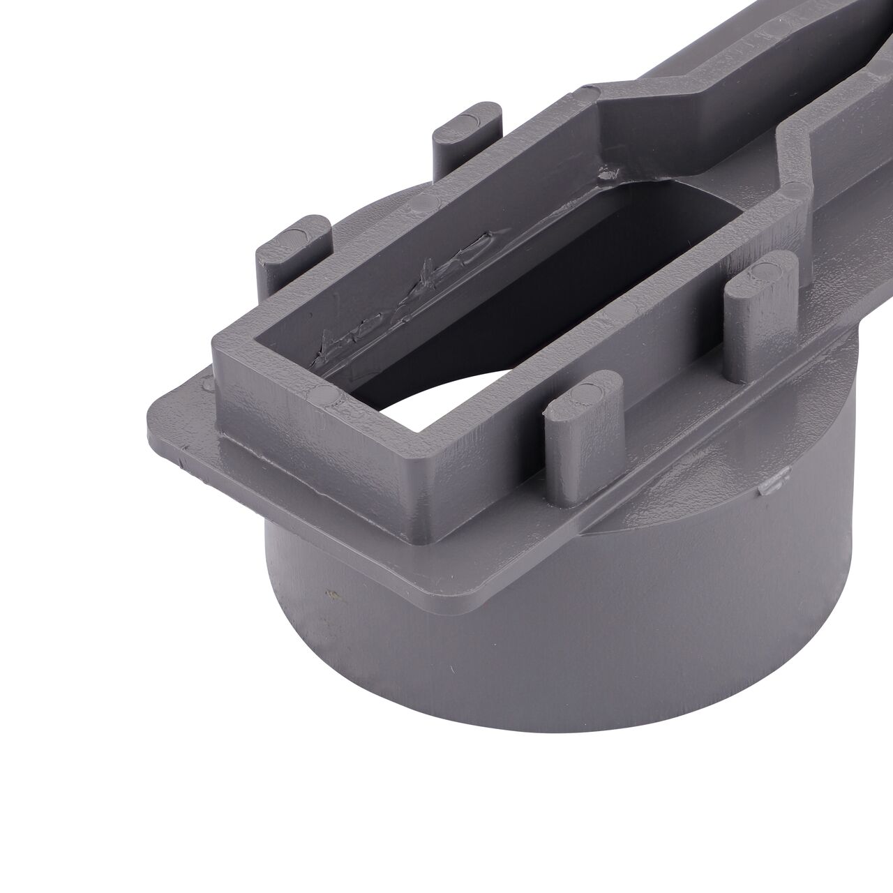 Closeup of the tabs in the back of the NDS Gray Micro Channel™ Drain End Outlet (NDS 8463)