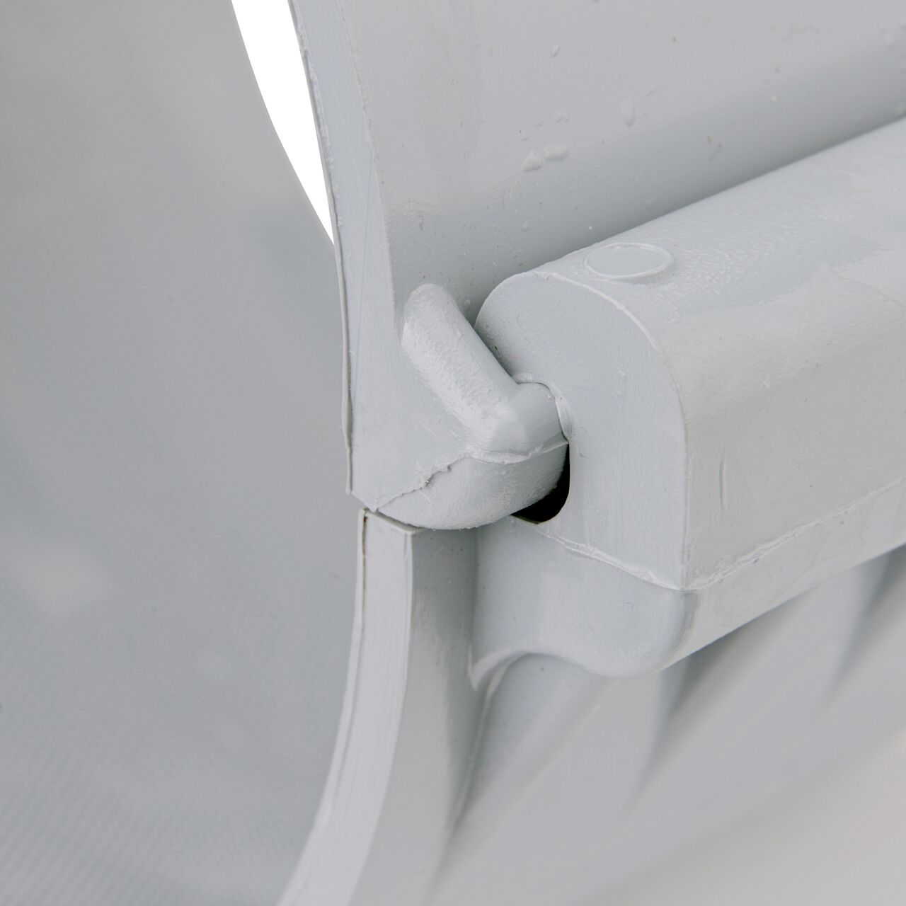 Closeup of the hinge closed on the NDS Clamp-It™ Rigid PVC Saddle with 1 in. FPT connection on top (NDS 446010) for 6 in. PVC pipe