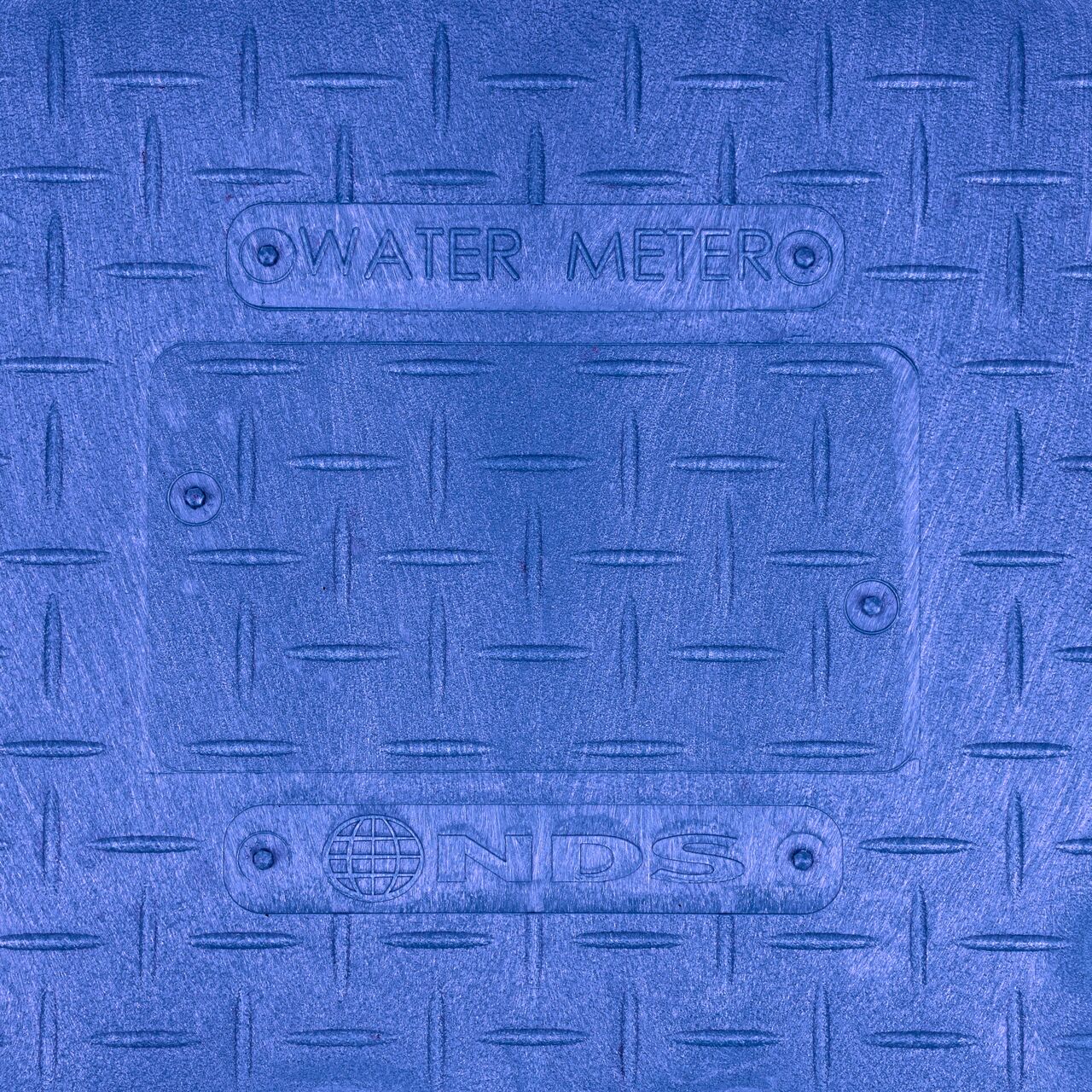 Closeup view of the Water Meter markings on the Blue Water Meter Overlapping cover for the NDS 14 in. X 19 in. Rectangular Standard Series Meter Cover (NDS D1200-OLBLL)