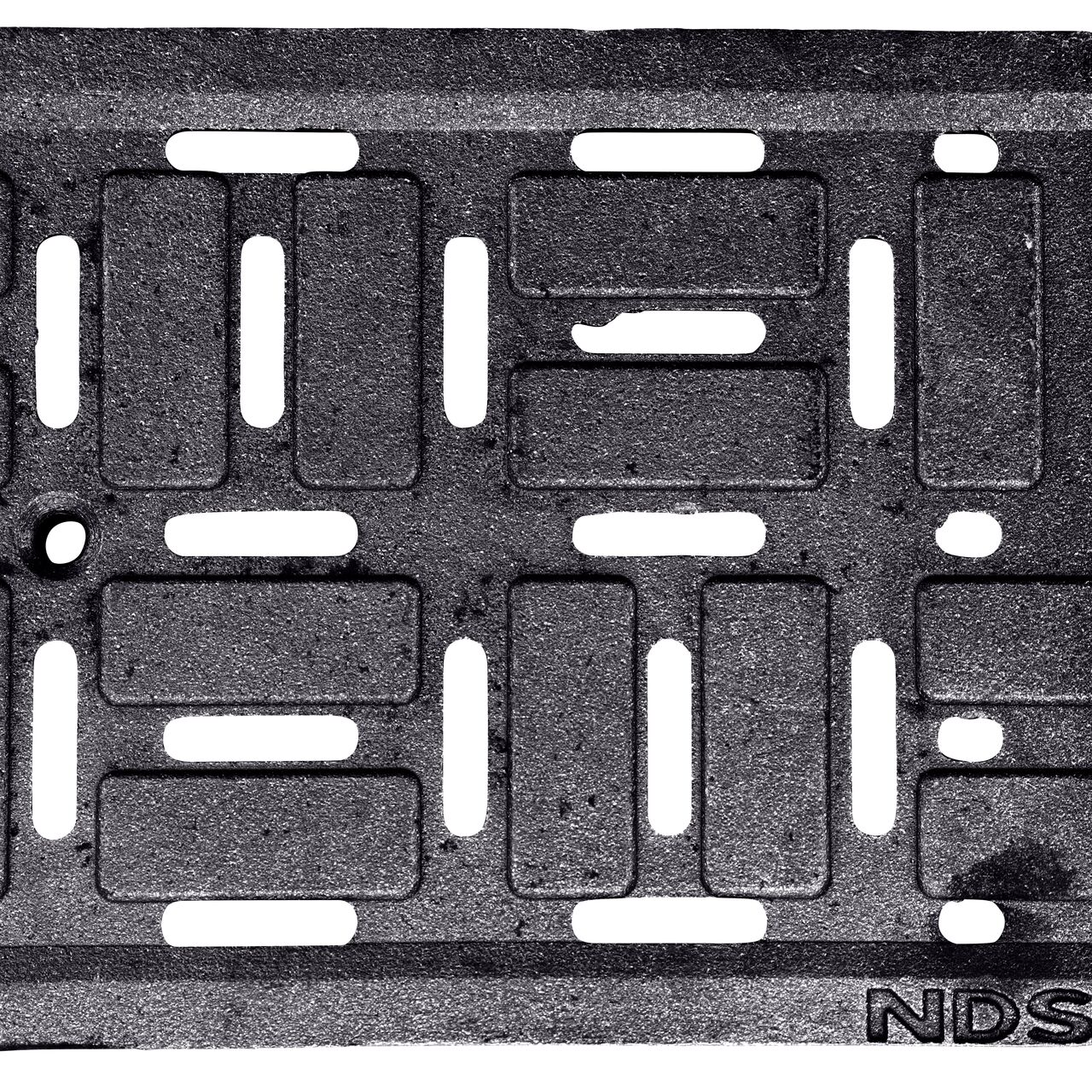 Top Down View of the ductile iron Dura Slope™ Channel Drain Grate (NDS DS-603) decorative brick pattern design