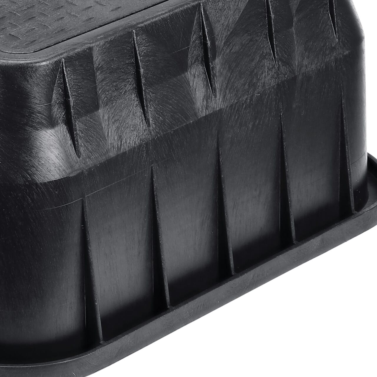 Closeup view of the pipe hole on the Black NDS 13 in. X 24 in. Rectangular Standard Series Meter Box (NDS 125BCDMCIFB) for water and irrigation pipe connections