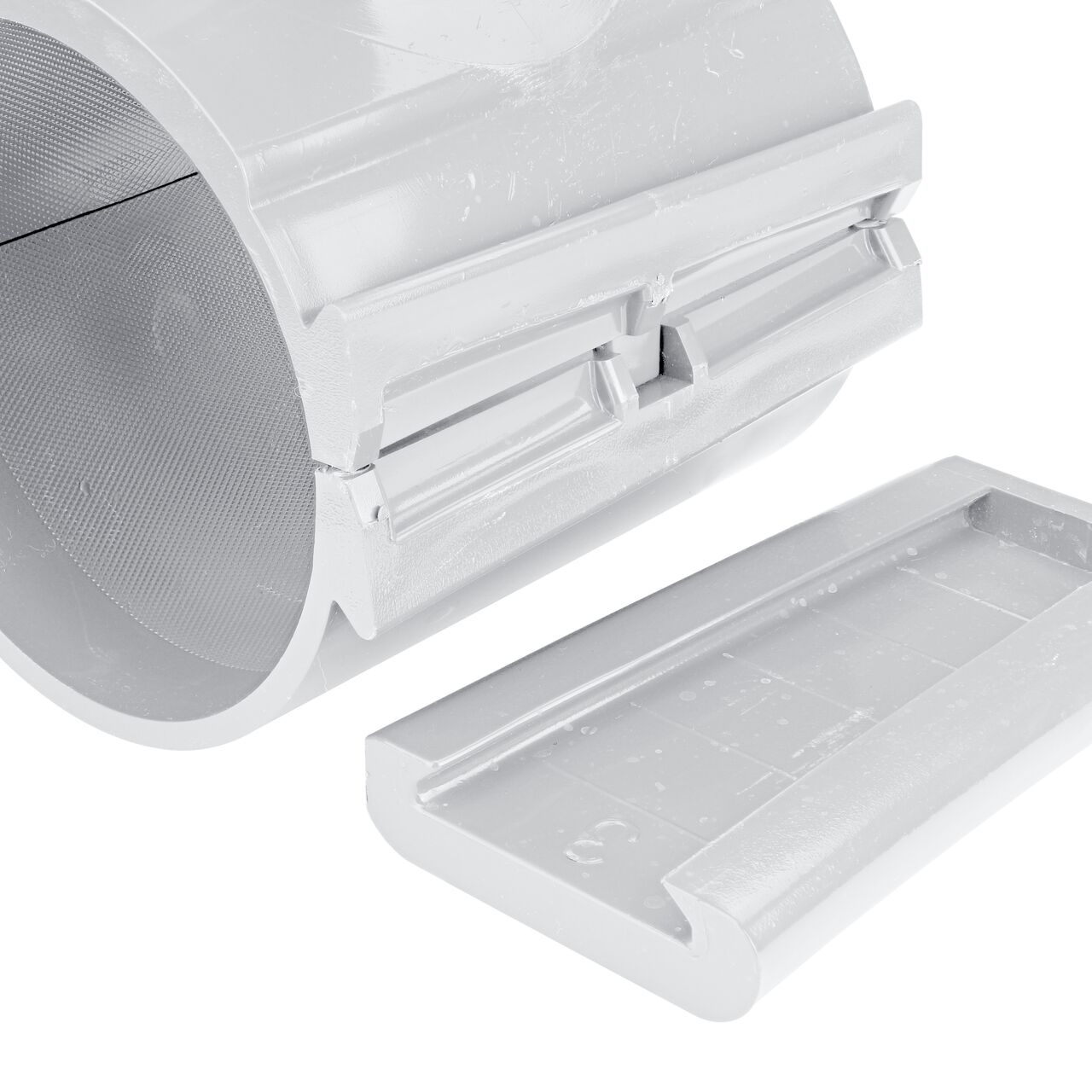 Closeup view of the patented wedge which unconnects on the 4 in. NDS Flo-Tap™ Rigid PVC saddle with 1-1/2 in. socket or 2 in. spigot for easy installation (NDS 3240)