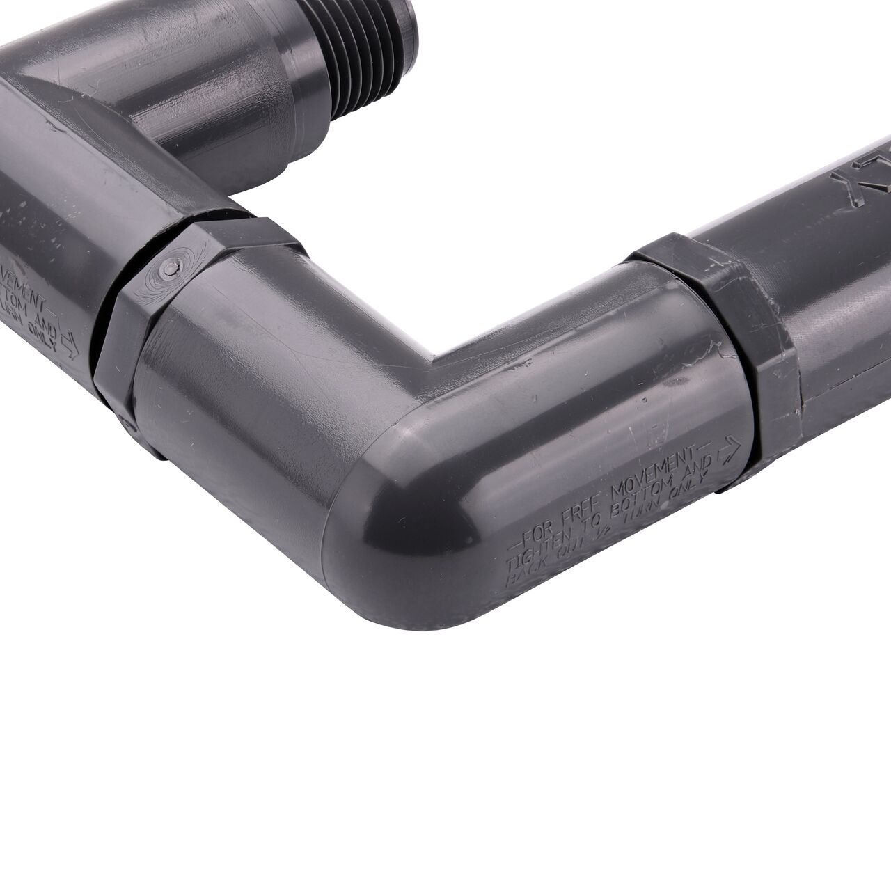 Closeup view of the NDS PVC Triple Swing Joints Assembly, Sch. 80 1/2 in. spigot X 1/2 in. MPT showing the flow direction and sprinkler can easily be repositioned after installation if needed (NDS TSA-0500-ST)