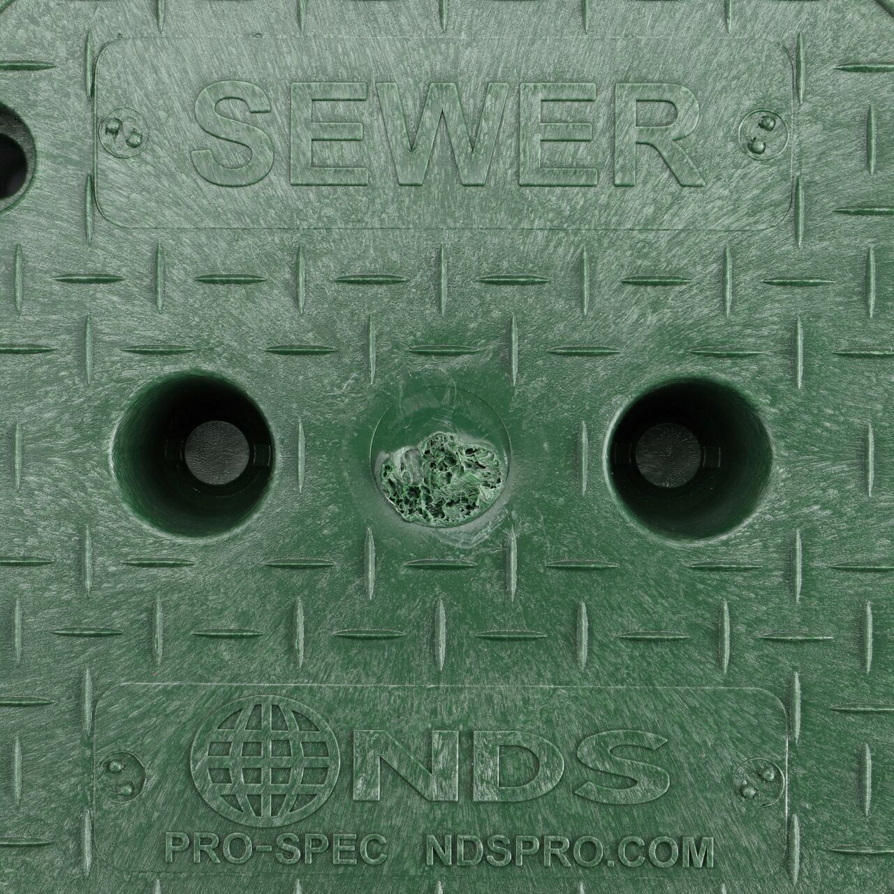 Closeup view of the Water markings on the Green Sewer cover for the NDS 10 in. Round Pro-Spec® Series Valve Box (NDS 312BCBS)