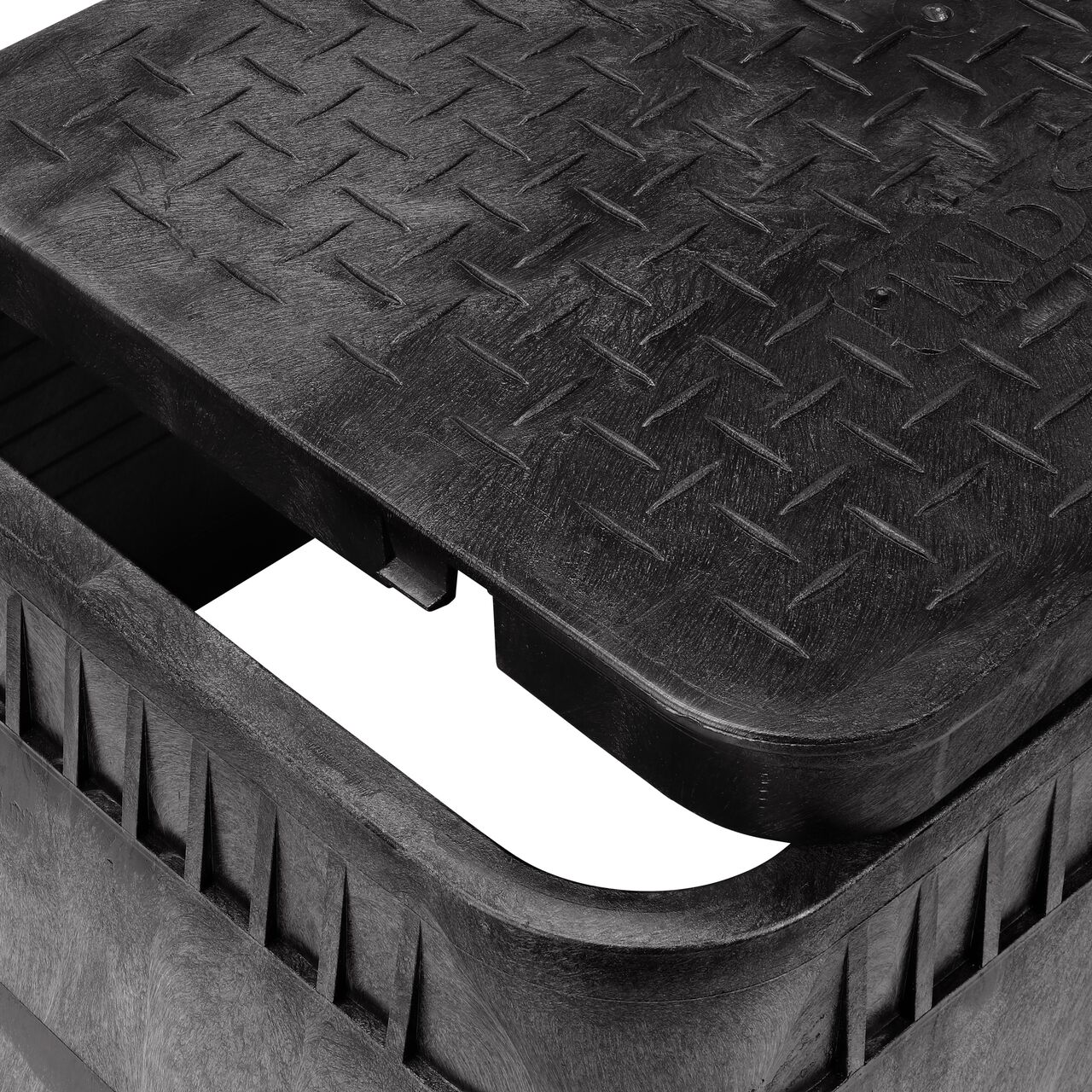Closeup view of the Dual pipe holes on the Black NDS 13 in. X 20 in. Rectangular AMR Meter Box (NDS D15DU-BAMR) for water and irrigation pipe connections