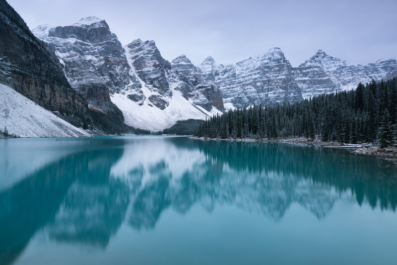 First snow Morning at Moraine Lake in Banff National Park Alberta Canada Snow-covered winter mountain lake in a winter atmosphere. Beautiful background photo