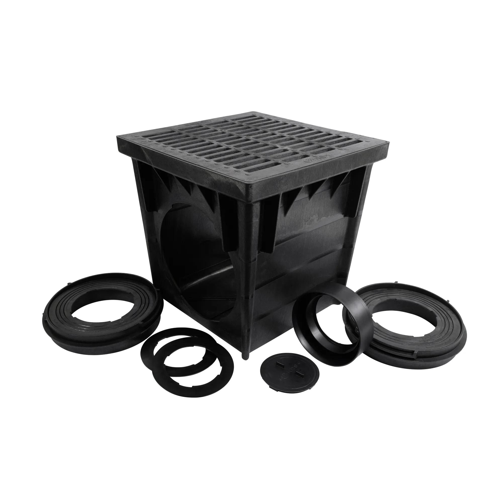 Unassembled Black plastic 24 in. Catch Basin Drain Kit (NDS 2400BLKIT) with a black grate (NDS 2411), adapters (NDS 2410, NDS 1888, NDS 1890) that connects to 8 in. and 10 and 12 in. drainage pipes, and plug (NDS 1206)